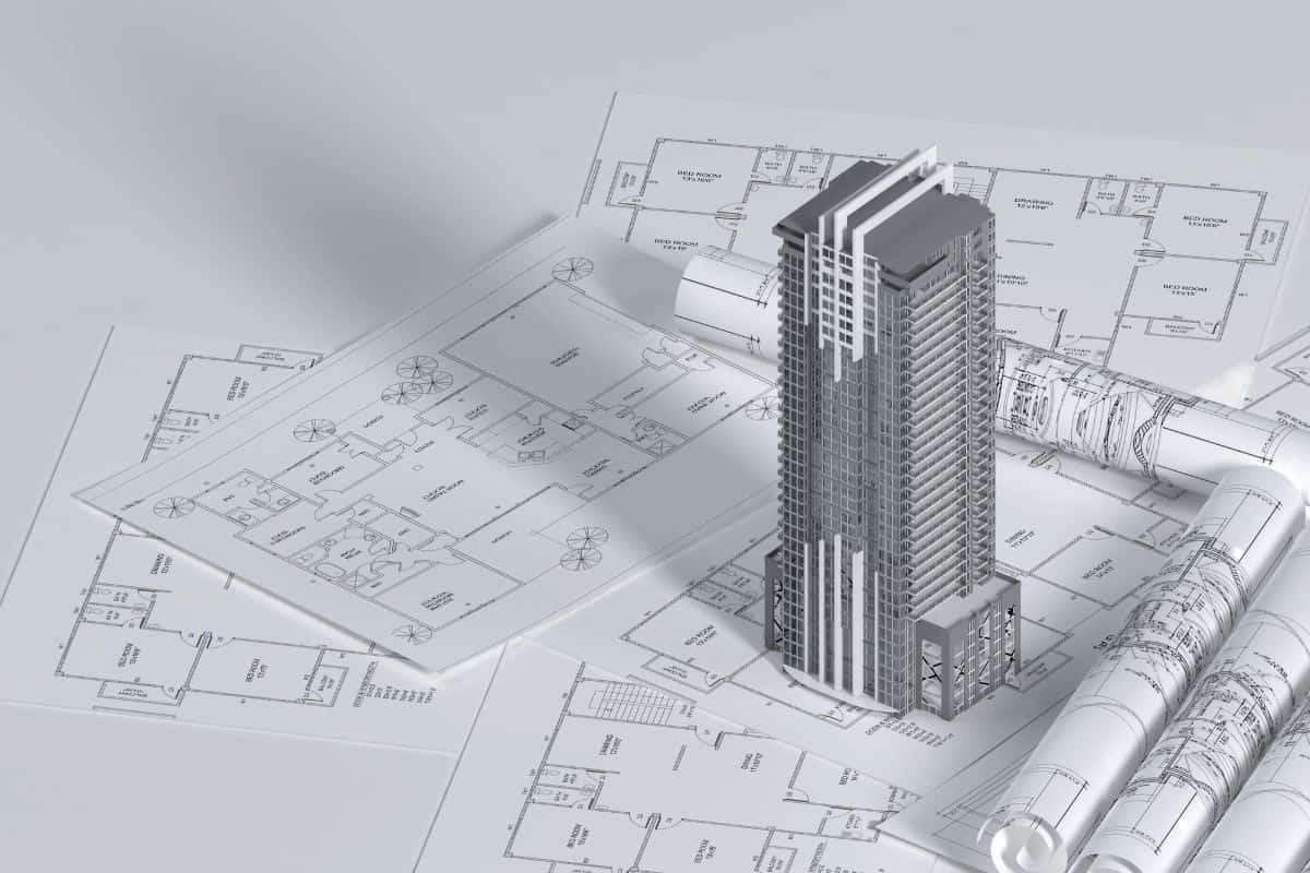 Architectural floor plan drawings beside a tall apartment building model, illustrating floor plans for Serene Sagara