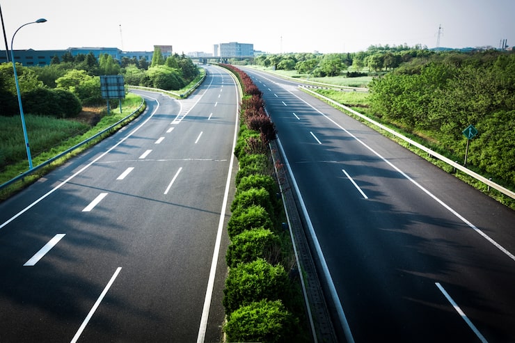 Wide highway through green surroundings, illustrating road connectivity to Serene Sagara